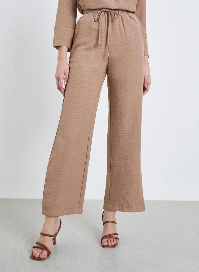 ستايلي بنطال بأرجل واسعة بنمط نسيج كتان